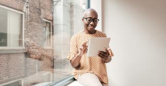 Woman scrolling on tablet